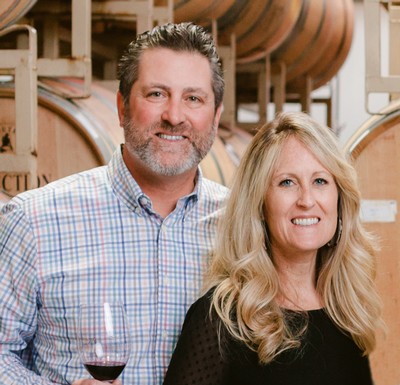 Red Stitch Wine, The Aurilias, featuring winemakers in a cellar with wine barrels.